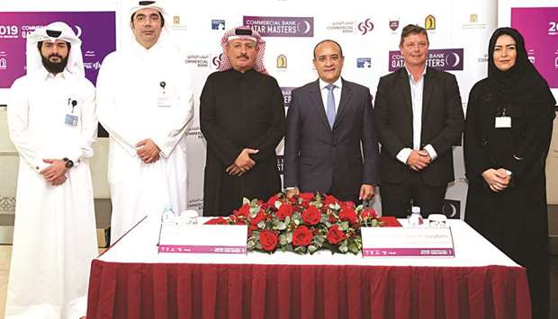 Fahad Nasser al-Naimi, General Secretary of Qatar Golf Association (third from left) and Joseph Abraham, Group CEO, Commercial Bank, (fourth from left) pose with other officials after the sponsorship signing ceremony.