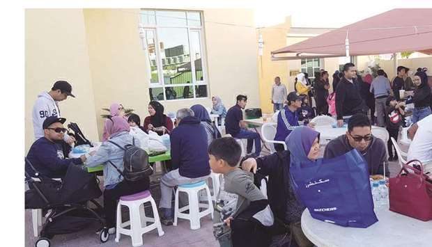 GATHERING: Expatriates in Doha enjoying authentic Malaysian food at the event. Photos supplied