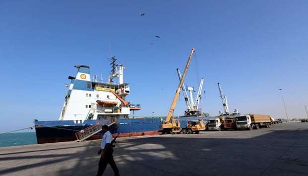 A coast guard walks past a ship docked at the Red Sea port of Hodeidah, Yemen. Picture taken on January 5, 2019