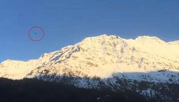 The helicopter (marked in the circle) minutes before the crash. Photo courtesy: La Repubblica