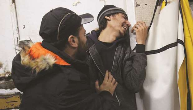 A relative of Ehab Abed, 25, reacts as she identifies his body at a hospital in Rafah in the southern Gaza Strip, yesterday.