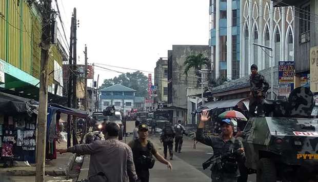 Soldiers guarding cathedral in Jolo after the explosions. AFP-Armed Forces of the Philippines, Western Mindanao Command