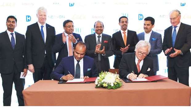 Ahamed signs the agreement with van Liempt to develop the IntercityHotel Zurich Airport, in the presence of Yusuff Ali MA, chairman and managing director, LuLu Group International; Thomas Willms, CEO, Deutsche Hospitality; and other dignitaries in Zurich, Switzerland.