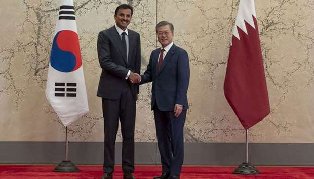 His Highness the Amir Sheikh Tamim bin Hamad Al-Thani shakes hand with South Korean President Moon Jae-in