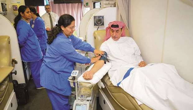 Ali S al-Fadala, senior deputy Group president and CEO of QIC Group, during the blood donation campaign.