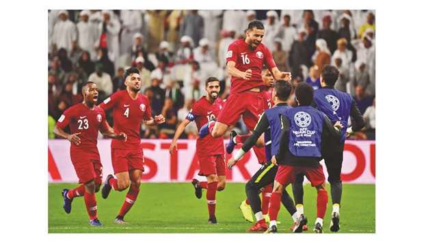 Qataru2019s Boualem Khoukhi (C) celebrates his goal with teammates during the AFC Asian Cup semi-final against the UAE in Abu Dhabi yesterday. (AFP)