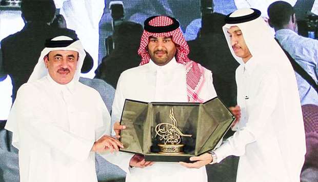 GWC vice-chairman Sheikh Fahad with HE the Minister of Transport and Communications Jassim Seif Ahmed al-Sulaiti and another senior official at the award ceremony.