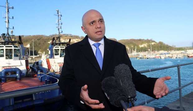 Britain's Home Secretary Sajid Javid speaks to members of the media yesterday, after meeting with UK Border Force staff on the quayside at Dover, in south-east England