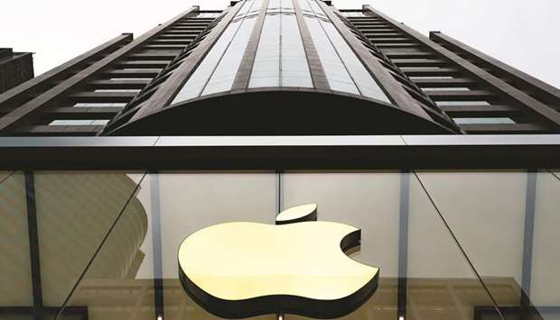 The Apple logo is displayed at one of the companyu2019s stores in Hong Kong. Apple on Wednesday lowered its outlook for first-quarter revenue after a larger-than-expected slowdown in demand from China and fewer upgrades to models of the iPhone.