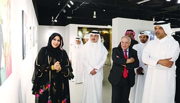 Kuwaiti artist Dr Iman al-Shammari briefs Katara officials and other dignitaries during a tour of the exhibition
