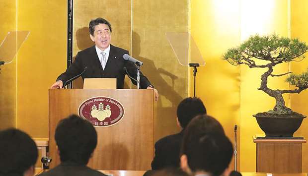 Japanese Prime Minister Shinzo Abe answers a question during his new year press conference in Ise, Mie prefecture, yesterday.