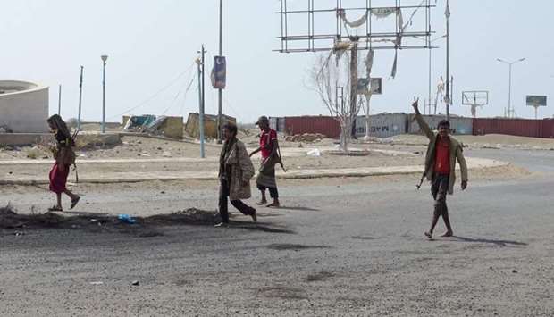 Members of the Yemeni pro-government forces gather at the eastern entrance of the port city of Hodeidah on December 30, 2018