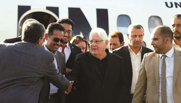 United Nations envoy to Yemen, Martin Griffiths (centre), shakes hands with Houthi officials upon his arrival at Sanaa airport in Sanaa, yesterday.