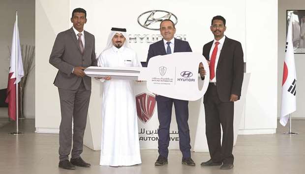 Officials from Skyline Automotive and Pick Me Up Limousine at the handover ceremony.