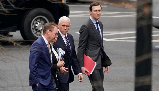 Acting White House Chief of Staff Mick Mulvaney, US Secretary of Homeland Security Kirstjen Nielsen (obscured), US Vice President Mike Pence and Senior White House Advisor Jared Kushner walk from the West Wing before a meeting with Congressional staffers about ending the partial government shutdown at the White House.