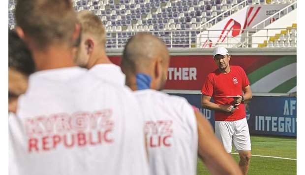 Kyrgyzstan coach Aleksandr Krestinin guides a training session in Al Ain yesterday. (AFP)
