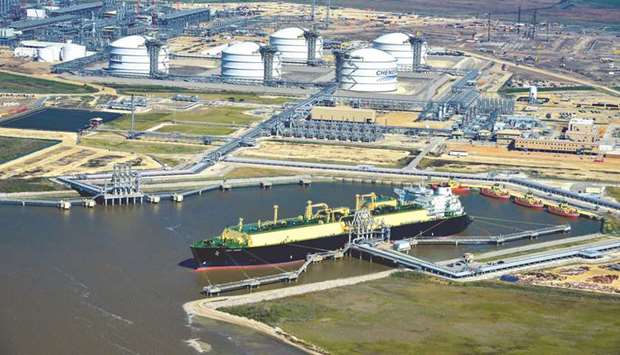 An LNG carrier sits docked at the Cheniere Energy terminal in this aerial photograph taken over Sabine Pass, Texas (file). US gas production jumped 12% in 2018 to a record 89.6bn cubic feet a day while consumption was 81.7bn cubic feet per day, according to the US Energy Information Administration.