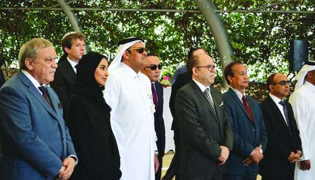 Russian ambassador Nurmakhmad Kholov joins other dignitaries at the tree-planting ceremony.