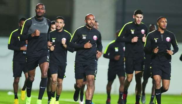 AFC Player of the Year Abdelkarim Hassan (L) trains with his Qatari teammates in Abu Dhabi Monday. Qatar will take on Lebanon in the first match of their Asian Cup campaign in the UAE capital on Wednesday.