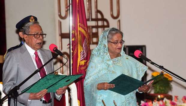 Bangladesh President Abdul Hamid (L) swears in Sheikh Hasina (R) for her fourth spell as Bangladesh's prime minister at the Presidential Palace in Dhaka