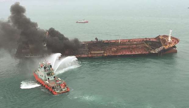 An oil tanker on fire is seen near Lamma island, Hong Kong, China.