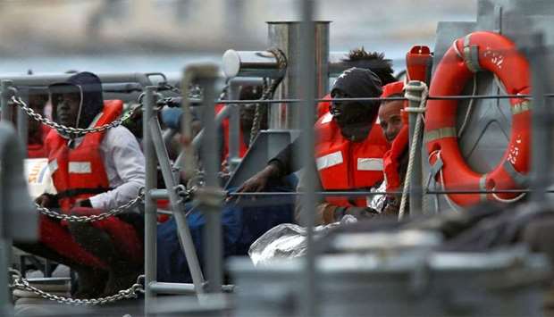 Migrants who were stranded on the NGO migrant rescue ships Sea-Watch 3 and Professor Albrecht Penck are seen on an Armed Forces of Malta patrol boat in Marsamxett Harbour