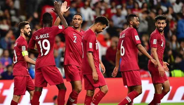 Qatar's forward Almoez Ali (L) high-fives with Qatar's defender Pedro Miguel Correia as they celebrate scoring a goal during the 2019 AFC Asian Cup group E football match between Qatar and Lebanon