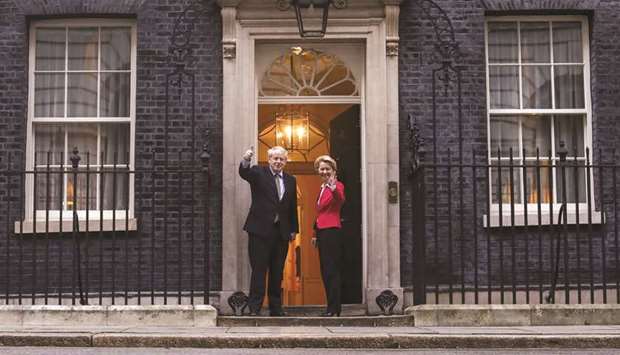 UK Prime Minster Boris Johnson (left) and Ursula von der Leyen, president of the European Commission, gesture to photographers on the steps of number 10 Downing Street in London on Wednesday.