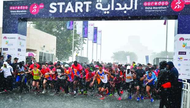 Runners of the Ooredoo Doha Marathon 2020 amid Friday's heavy downpour. PICTURE: Ram Chand.