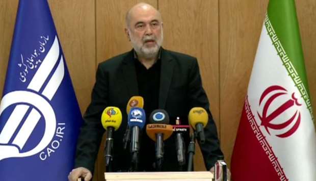 An image grab from footage obtained from the state-run Iran Press news agency shows Iran's civil aviation chief Ali Abedzadeh delivering a press statement in Tehran