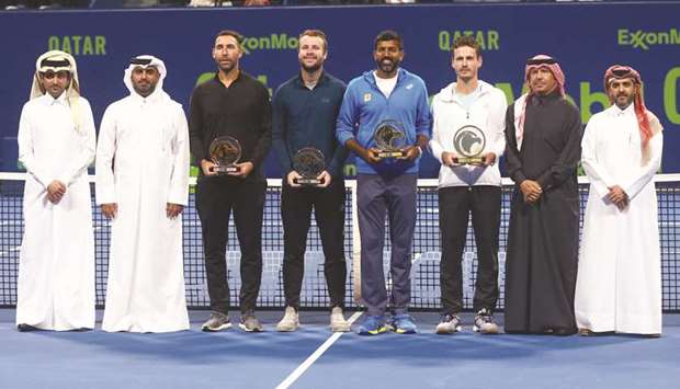 Qatar ExxonMobil Open doubles champions Indiau2019s Rohan Bopanna (fourth from right) and the Netherlandsu2019 Wesley Koolhof (third from right) pose with their trophies, runner-up pair of Britainu2019s Luke Bambridge (fourth from left) and Mexicou2019s Santiago Gonzalez (third from left), and officials during the prize distribution ceremony yesterday. PICTURE: Jayan Orma