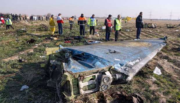 Rescue teams are seen at the scene of a Ukrainian airliner that crashed shortly after take-off near Imam Khomeini airport in the Iranian capital Tehran on  In this file photo taken on January 8