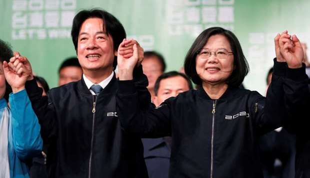 Taiwan Vice President-elect William Lai and incumbent Taiwan President Tsai Ing-wen celebrate at a rally after their election victory, outside the Democratic Progressive Party (DPP) headquarters in Taipei