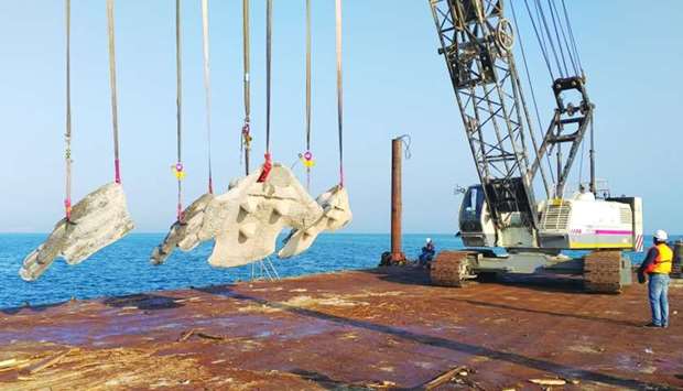 Artificial Coral Ridge modules being lowered into sea