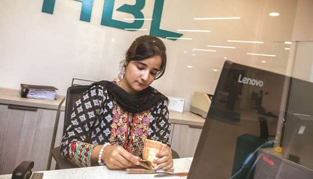 An employee counts Pakistani rupee banknotes at a Habib Bank branch in Karachi. Pakistan banksu2019 deposits accelerated to Rs14.6tn in 2019 up from Rs13.3tn in the previous year.Aluminium ingots sit in the cast house unit of the Vedanta Ltd in Jharuguda district, Odisha. The Quick Estimates of Indiau2019s  Index of Industrial Production with base 2011-12 for the month of November 2019 stands at 128.4, which is 1.8% higher as compared to the level in the month of November 2018, the Ministry of Statistics and Programme Implementation said.