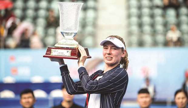 Ekaterina Alexandrova of Russia celebrates with the trophy after winning the final against Elena Rybakina of Kazakhstan at Shenzhen Open yesterday. (AFP)