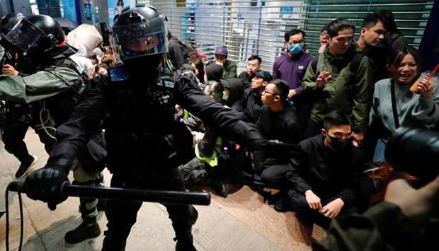 Riot police detain anti-government protesters in a large scale during a legal demonstration on the New Year's Day to call for better governance and democratic reforms in Hong Kong