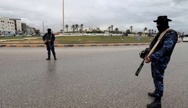 Central security support force carry weapons during the security deployment in the Tajura neighborhood, east of Tripoli, Libya