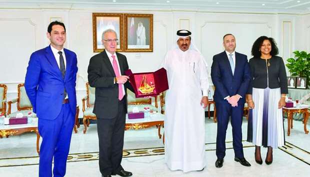 Qatar Chamber first vice chairman Mohamed bin Towar al-Kuwari handing over a token of appreciation to Arab-Brazilian Chamber of Commerce president Rubens Hannun and secretary general Tamer Mansour during a meeting held in Doha.