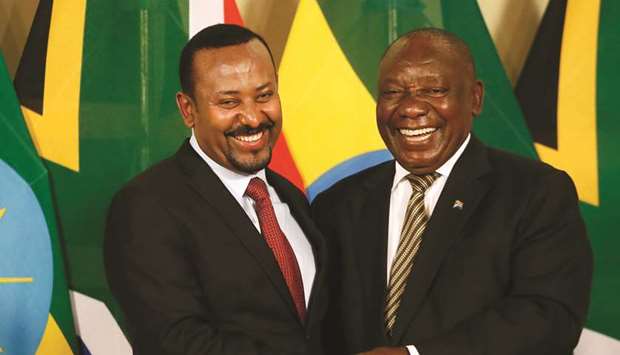 South African President Cyril Ramaphosa and Prime Minister of Ethiopia Abiy Ahmed shake hands after concluding a press conference at the Union Buildings in Pretoria, yesterday.