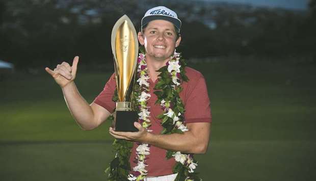 Cameron Smith of Australia celebrates with the winneru2019s trophy after the final round of the Sony Open in Hawaii at the Waialae Country Club. (Getty Images/AFP)
