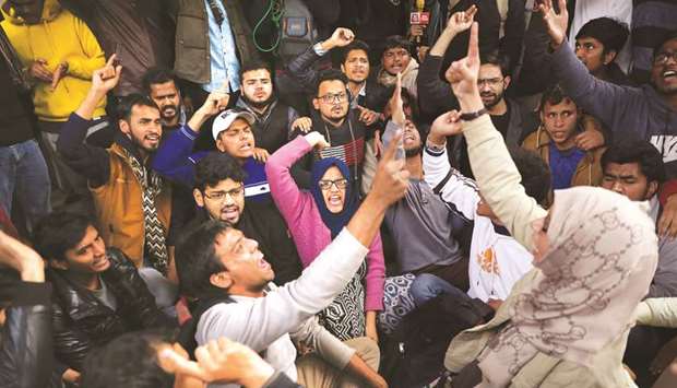 Students of the Jamia Millia Islamia university demonstrate against their Vice Chancellor Najma Akhtar and demand an inquiry against police action on students following a protest last month against a new citizenship law, in New Delhi, yesterday.