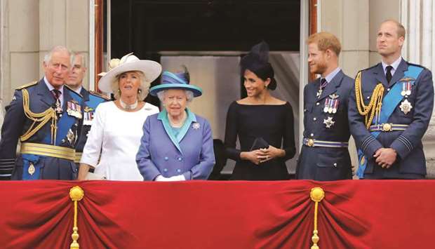This file photo taken on July 10, 2018 shows (from left) Prince Charles, Duchess of Cornwall Camilla, Queen Elizabeth II, Duchess of Sussex Meghan, Prince Harry, and Prince William, on the balcony of Buckingham Palace to watch a military fly-past to mark the centenary of the Royal Air Force (RAF).