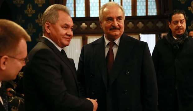 Russian Defence Minister Sergei Shoigu shaking hands with Libya's Khalifa Haftar in Moscow. AFP/Russian Foreign Ministry/HO
