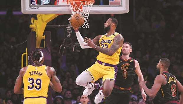 Los Angeles Lakersu2019 LeBron James (centre) scoring past Cleveland Cavaliersu2019 Kevin Love (second right) and Tristan Thompson (right) during the second half at Staples Center. PICTURE: USA TODAY Sports