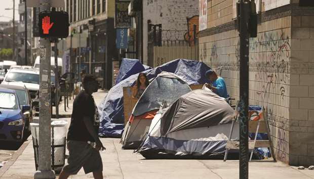 Tents and tarps are erected by homeless people along sidewalks and streets in the skid row area of downtown Los Angeles.