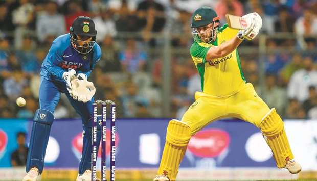 Australiau2019s Aaron Finch (right) plays a shot during the first ODI against India at the Wankhede Stadium in Mumbai yesterday. (AFP)