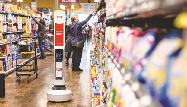 A Simbe Robotics Tally shelf-scanning robot travels through an aisle at a Giant Eagle Market District supermarket in Pittsburgh, Pennsylvania. The Labour Department said yesterday its consumer price index increased 0.2% last month after climbing 0.3% in November.