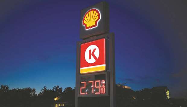 The price for unleaded fuel is displayed on a sign outside a Royal Dutch Shell gas station at night in Louisville, Kentucky (file).