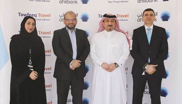 Ahlibank Deputy CEO u2014 Business Support Services and Human Resources Mohamed al-Namla with Tawfeeq Travel CEO Rehan Ali Syed, and other senior officials.